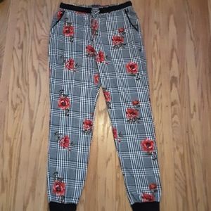 Black and white joggers with red flower